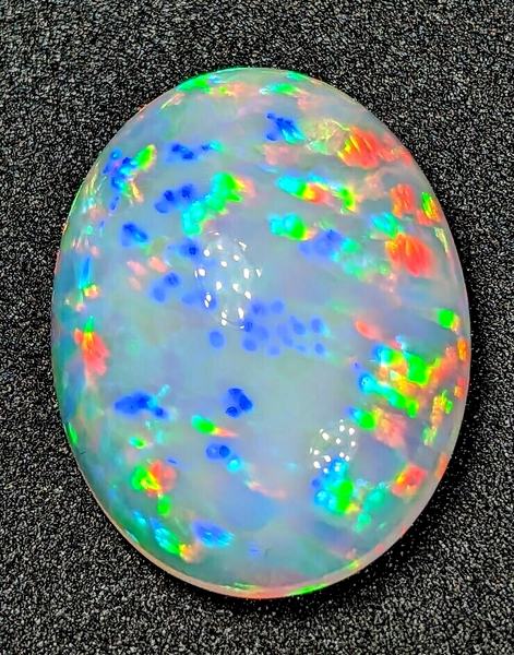 25.4ct Welo Opal Oval Cabochon AAAA Loose Prism Flash Ethiopian