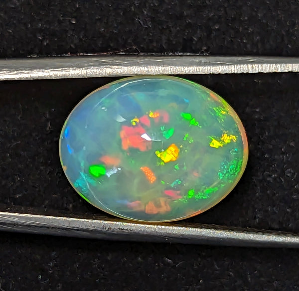 7.8ct Welo Opal Oval Cabochon AAAA Ethiopian Honeycomb Rainbow Loose VIDEO