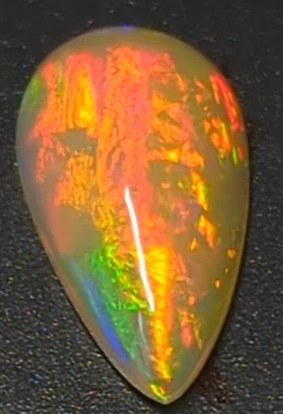 6.3ct Welo Opal Pear Cabochon AAAA Loose Ethiopian Fire Ball Flash